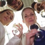 Businesspeople toasting glasses of champagne in office