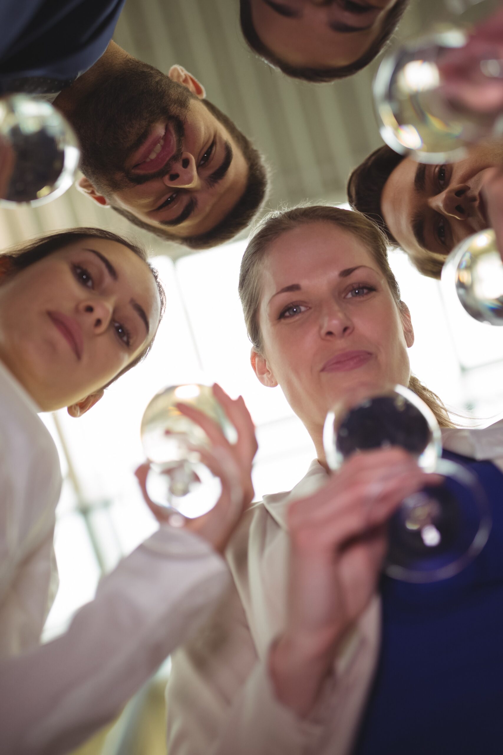 Businesspeople toasting glasses of champagne in office