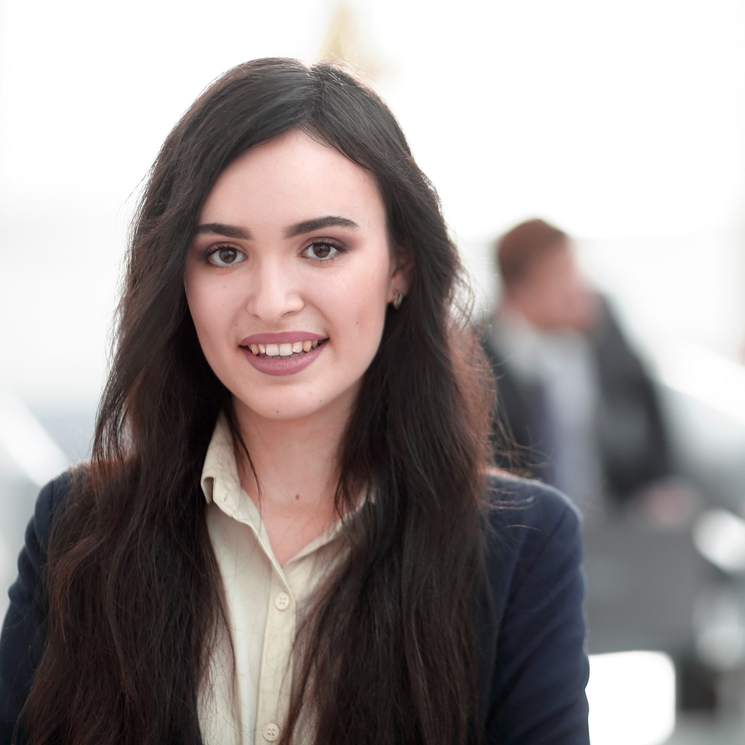 Portrait of businesspeople working with female leader in front.